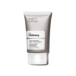 Un tube de The Ordinary Crème Visage Facteurs Naturels d'Hydratation PhytoCéramides 30 ml, avec le design minimaliste blanc et gris de la marque et le texte noir sur le devant, se dresse debout sur un fond blanc épuré. Dakar