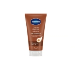 Un tube de 75 ml de crème pour les mains Vaseline Intensive Care Cocoa Hydrate, étiqueté « Beurre de cacao pur » et « Adoucit les mains dès la 1ère utilisation » avec une image de fève de cacao, parfait pour les fans de Topicrem Ultra-Hydratante Crème Mains. Dakar