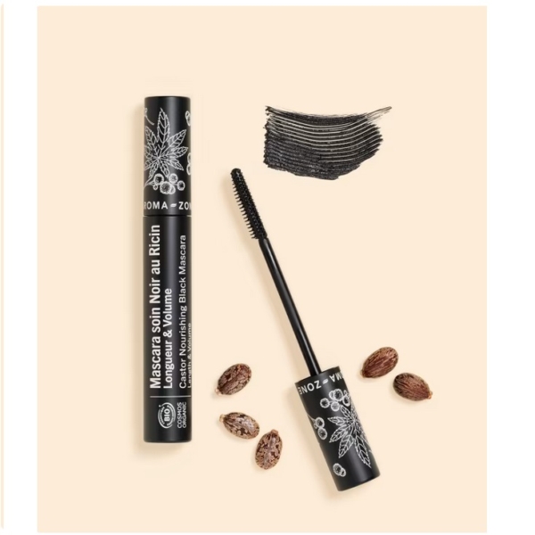 Un tube de Mascara Aroma Zone soin Noir au Ricin BIO 10ml au design botanique, son applicateur baguette, un trait de mascara noir et plusieurs graines de ricin disposées sur un fond beige. Dakar