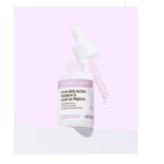 Aroma Zone Sérum Anti-taches Hordatine et Extrait de Réglisse 30 ml avec compte-gouttes se dresse sur un fond rose pastel, une goutte scintillante à la pointe. Dakar