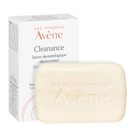 Une barre d'Avène Nettoyant Solide Désincrustant Peau grasse - Imperfections 100g est présentée devant sa boîte blanche, qui affiche le logo Avène et les détails du produit en français. Dakar