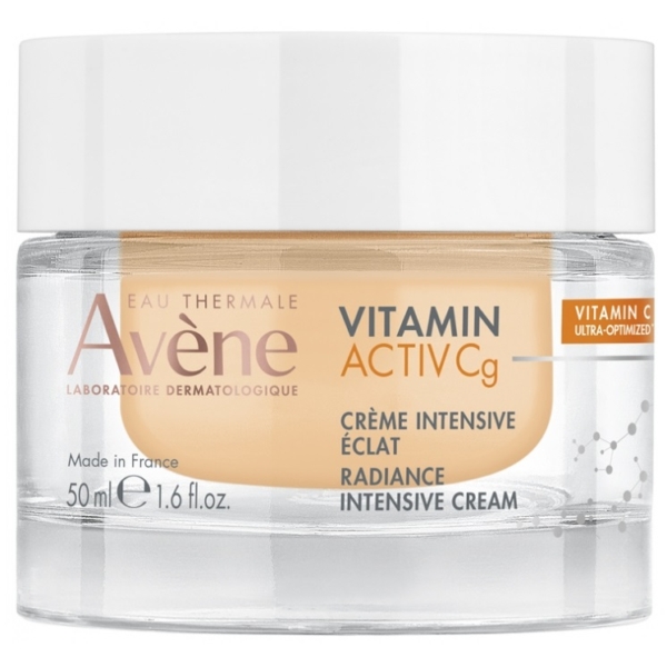 Le pot de 50 ml d'Avène Vitamine Activ Cg Crème Intensive Éclat présente un couvercle blanc, une base transparente révélant une crème beige, et une étiquette mettant l'accent sur la vitamine C et l'éclat - semblable à celle de Kojie San Crème Visage. Dakar