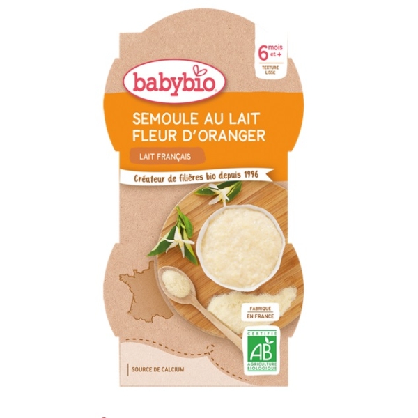 Babybio Desserts lactés bébé Semoule au Lait Fleur d'Oranger 2x100g, avec un bol de pouding à la semoule, des fleurs de fleur d'oranger et des labels bio français sur l'emballage ; convient aux bébés à partir de 6 mois. Complète Babybio Banane Lait de Coco des 6 mois. Dakar
