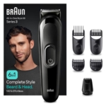 La Braun Tondeuse Homme 6 en 1 Series 3 MGK3410 Noir avec Batterie est présentée avec une tondeuse et quatre peignes. L'emballage présente un homme à la barbe stylisée, en soulignant "6 en 1" et "100% sans effort". Dakar