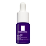 Un flacon en verre violet de La Roche Posay B3 Sérum 10 ml avec un bouchon compte-gouttes blanc. L'étiquette affiche le nom de la marque et les détails du produit en texte blanc. Dakar