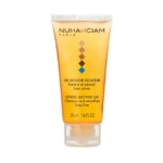 Un tube de 50 ml de Nuhanciam Gel Douche, présentant un dessin orange dégradé avec un motif en forme de diamant, est étiqueté "Nettoie et adoucit" et "Sans savon". Dakar