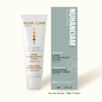 Un tube et une boîte de Nuhanciam Crème Éclaircissante Anti Taches Visage 50 ml avec un emballage blanc minimaliste français et anglais pour le visage et le cou, présentés sur un fond clair. Dakar