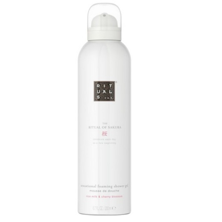 Un flacon blanc de The Ritual of Sakura Mousse de Douche 200 ml, doté d'un logo argenté et d'un texte rose, offre un mélange de parfums luxueux de lait de riz et de fleur de cerisier. Dakar