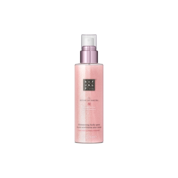 Un flacon rose et scintillant de 150ml de RITUALS The Ritual Of Sakura Brume Scintillante Pour Corps avec un bouchon argenté et une pompe blanche est présenté sur un fond blanc. Dakar