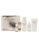 Cinq produits Skin1004 Coffret Édition Spécial Éclaircissant Visage - flacons, compte-gouttes et tubes dans des tons neutres - sont disposés devant une boîte "Summer Special Tone Brightening Edition". Dakar