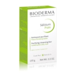 Une boîte de 100 g de Bioderma Sebium Pain Nettoyant et Purifiant Hypoallergénique pour les peaux mixtes/grasses, dans un emballage blanc et vert avec les détails du produit et de la marque en anglais et en français. Dakar