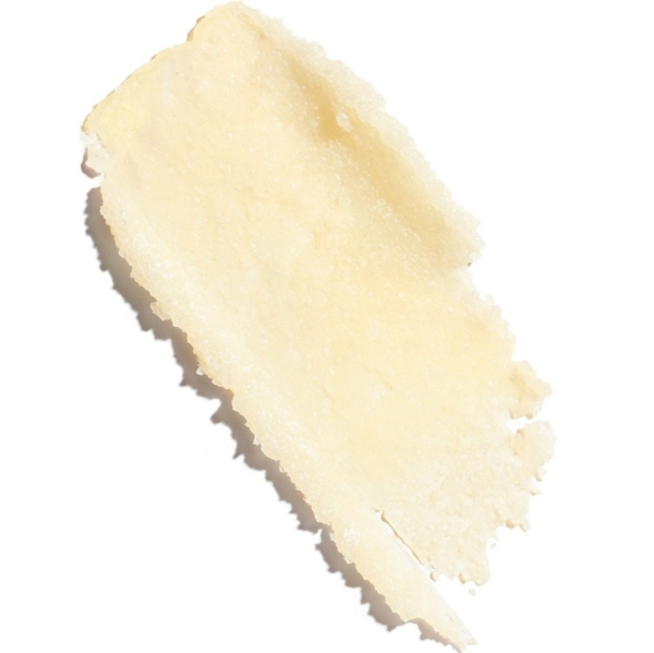 Aroma Gommage Corps au Sucre Tonic aux Huiles Essentielles Clarins 250 ml se présente sous la forme d'un gommage crémeux, jaune pâle, à la surface légèrement irrégulière et texturée sur fond blanc. Dakar
