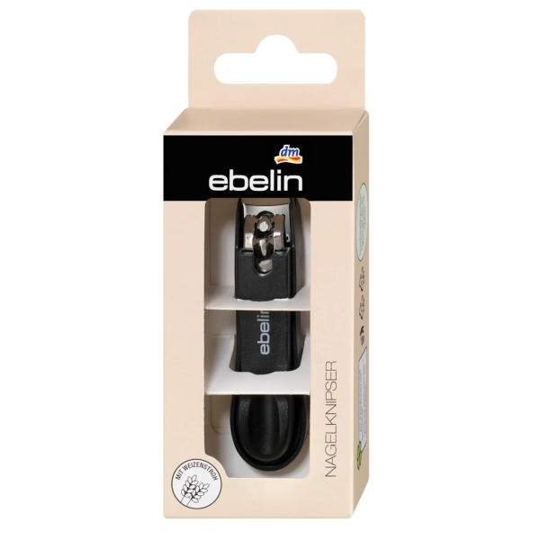 Un coupe-ongles Ebelin Coupe Ongles 1 Pièce noir est présenté dans une boîte beige avec une fenêtre transparente. La marque et les détails du produit sont imprimés sur l'emballage. Dakar
