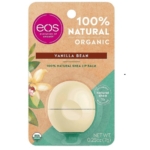 Un emballage d'EOS Baume à Lèvres 100% Naturel Et Biologique Sphere Vanille 7g présente un contenant beige avec une fleur de vanille et des accents verts, soulignant le "karité 100% naturel" et la certification biologique de l'USDA. Dakar