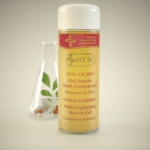 Un flacon de HT26 Gel Douche Multi-éclaircissant 1000ml se trouve devant un petit flacon en verre avec une feuille verte et une fleur blanche à l'intérieur, sur un fond neutre. Dakar