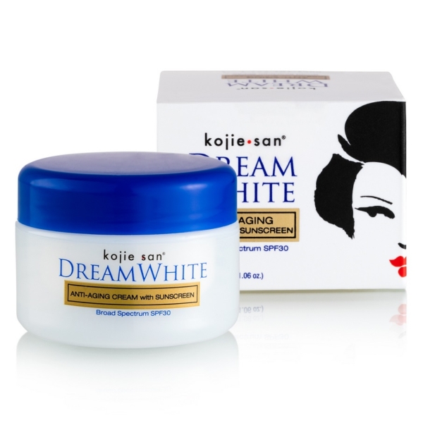 Un pot de Kojie San Dream White Crème Hydratante Visage SPF30 Anti Age 30 ml est présenté devant sa boîte, qui montre une illustration partielle en noir et blanc du visage d'une femme. Dakar