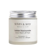 Un pot blanc de Mary and May Masque Purifiant au Niacinamide 125 ml avec un couvercle argenté se trouve à côté du Mary and May Masque à l'Eau de Rose. L'étiquette indique 1 % de niacinamide et 4 000 ppm d'écorce de citron. Dakar