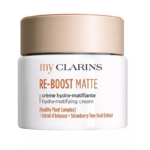 Le pot blanc de My Clarins RE-BOOST Matte Crème Hydra-Matifiante (50ml) pour peaux mixtes à grasses, avec un couvercle beige et mettant en valeur le complexe végétal et l'extrait de fruit d'arbousier. Dakar
