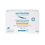 Une boîte de 200g de Neutraderm Savon Doux Surgras Dermo-Protecteur, pour les peaux sensibles et sèches, adapté au visage et au corps, dans un emballage bleu et blanc et testé dermatologiquement. Dakar