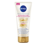 Un tube de 200 ml de Nivea Crème Corps 48h Anti Vergetures Et Taches Luminous 630 Teint Unifié, conçu pour réduire les taches, prévenir les vergetures et unifier le teint. Ce tube comporte des accents dorés et un étiquetage français/néerlandais. Dakar
