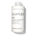 Un flacon blanc d'Olaplex N°5 Bond Maintenance Après-Shampoing 250 ml, idéal pour être associé à Olaplex N°7 Bonding Oil pour réparer, renforcer et hydrater tous les types de cheveux. Contient 250 ml (8.5 fl oz). Dakar