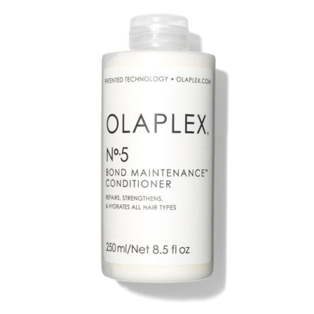 Un flacon blanc d'Olaplex N°5 Bond Maintenance Après-Shampoing 250 ml, idéal pour être associé à Olaplex N°7 Bonding Oil pour réparer, renforcer et hydrater tous les types de cheveux. Contient 250 ml (8.5 fl oz). Dakar