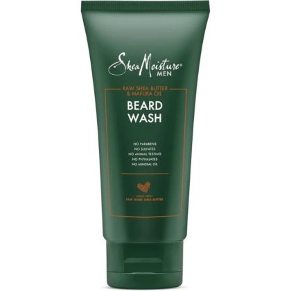 Un tube vert de 177ml de Shea Moisture Beard Wash Nettoyant pour la barbe, contenant du beurre de karité brut et de l'huile de mafura. L'étiquette mentionne l'absence de parabènes, de sulfates, de tests sur les animaux, de phtalates et d'huile minérale. Dakar