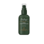 Un flacon vert foncé de 100ml de Shea Moisture Huile Revitalisant pour barbe au maracuja et au beurre de karité avec un distributeur à pompe et un texte doré sur l'étiquette, présenté sur un fond blanc. Dakar