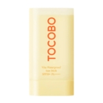 Un Tocobo Stick Solaire Spf50 Vita Waterproof Sun 18g jaune avec un texte orange en gras se trouve à côté de la Tocobo Crème, offrant une routine solaire complète. Dakar