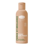 Le flacon beige de 150 ml de WAAM Synergie Bain d'huiles Fortifiante, avec un texte vert et blanc et un bouchon à clapet, affiche "Force et Brillance" et met l'accent sur les ingrédients naturels. Dakar