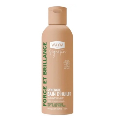 Le flacon beige de 150 ml de WAAM Synergie Bain d'huiles Fortifiante, avec un texte vert et blanc et un bouchon à clapet, affiche "Force et Brillance" et met l'accent sur les ingrédients naturels. Dakar