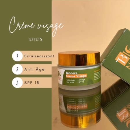 Un pot de Bionora Crème Hydratante SPF15 Illuminatrice Anti Taches avec un couvercle doré se trouve à côté de sa boîte verte. Le texte sur fond vert olive met en avant ses vertus éclaircissantes, anti-âge et protectrices SPF 15. Dakar