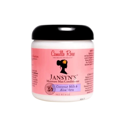 Un pot de 266 ml de l'après-shampoing Camille Rose Jansyn's Moisture Max, dans un récipient blanc avec un couvercle noir et une étiquette rose, nourrit les cheveux avec du lait de coco et de l'aloe vera pour une hydratation maximale. Dakar