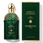 Un flacon vert de Guerlain Absolus Allegoria Oud Essentiel Eau de Parfum Femme 125ml avec un bouchon en nid d'abeille doré est présenté à côté de son coffret vert et or assorti, tous deux portant le logo Guerlain et le nom du produit. Dakar