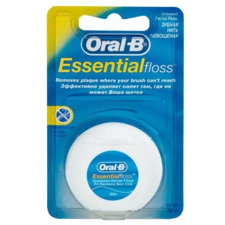 Oral-B ESSENTIAL FLOSS ORIGINAL 50 m Fil dentaire se présente dans un récipient blanc avec une étiquette bleue, emballé dans un blister bleu et jaune avec des informations sur le produit en anglais et en russe. Dakar