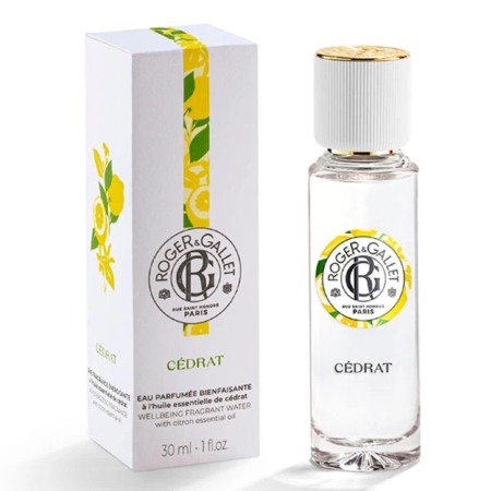 Un flacon de parfum Cédrat de Roger & Gallet avec un bouchon blanc se trouve à côté de son coffret blanc et jaune assorti, tous deux arborant le logo de la marque et un motif décoratif sur le thème des agrumes. Dakar