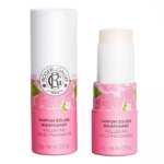 Deux tubes cylindriques roses et blancs de Roger et Gallet Rose Parfum Solide Parfum 5g, l'un avec le bouchon et l'autre sans le bouchon pour montrer le bâton de parfum à l'intérieur. Dakar