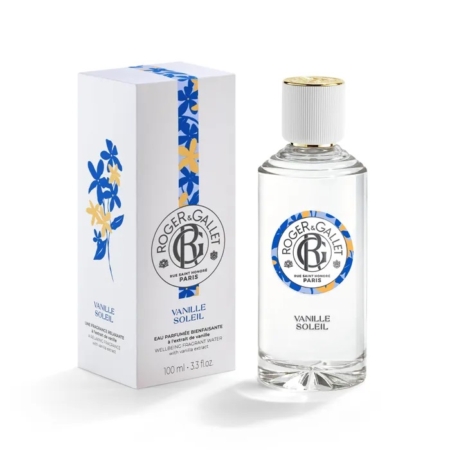 Un flacon de 100 ml de l'Eau de toilette Vanille Soleil Bienfaisante de Roger et Gallet, avec un bouchon doré et une étiquette ronde bleue et jaune, se trouve à côté de sa boîte blanche, décorée de motifs floraux bleus et jaunes. Dakar