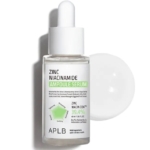 Un flacon compte-gouttes d'Aplb Sérum Ampoule Anti Imperfecti au Zinc à la Niacinamide et à la Centella 40 ml se trouve devant son bouchon blanc, étiqueté avec du zinc, de la niacinamide, de la centella et des ingrédients apaisants en texte noir et vert. Dakar