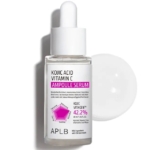 Flacon compte-gouttes d'Aplb Sérum Concentré Illuminatrice à l'Acide Kojique et Vitamine C 40 ml, présentant un motif géométrique rose et des détails sur les ingrédients, avec un bouchon blanc à côté sur fond blanc. Dakar