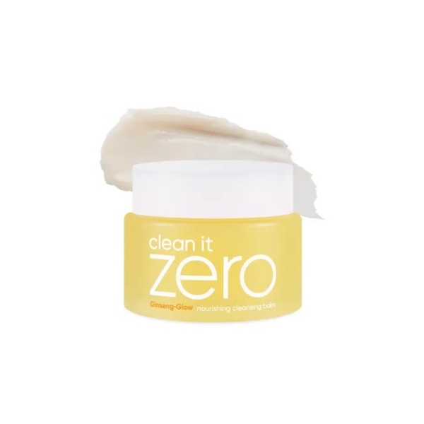 Un pot jaune de Banila Co Baume Nettoyant et Démaquillant Nourrissant Clean It Zero 100 ml avec un couvercle blanc à vis, présenté devant un frottis du baume sur fond blanc. Dakar