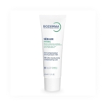 Un tube blanc de Bioderma Sébium Hydra Soin Ultra Hydratant Compensateur 40 ml se tient debout sur un fond blanc, avec un texte bleu et vert sur l'étiquette. Dakar