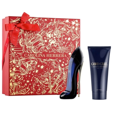 Un coffret cadeau rouge et or Carolina Herrera Coffret Good Girl Eau De Parfum avec un ruban est présenté à côté d'un flacon de parfum en forme de talon haut et d'un tube de lotion pour le corps Carolina Herrera assorti. Dakar