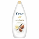 Bouteille blanche de 750 ml de Dove Douche Caring Bath Beurre de Karité et Vanille avec un bouchon doré, portant le logo Dove et des images de fleurs de vanille et de noix de karité sur l'étiquette. Dakar