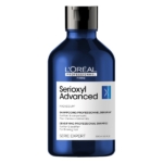 Un flacon bleu de 300 ml de L'Oréal Serioxyl Advanced Shampoing Densifiant et Volume Cheveux présente un bouchon noir, une étiquette blanche et des informations sur le produit pour les cheveux clairsemés. Dakar