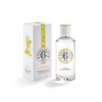 Un flacon en verre transparent du parfum Roger & Gallet Fleur d'Osmanthus est présenté à côté de sa boîte blanche, qui comporte des illustrations florales colorées et des accents orange. Le flacon est muni d'un bouchon blanc et d'une étiquette florale assortie. Dakar