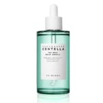 Flacon vert transparent de Skin1004 Madagascar Centella Tea Trica Ampoule Sérum Anti Imperfections 100ml, avec un bouchon compte-gouttes blanc et une étiquette frontale blanche. Dakar