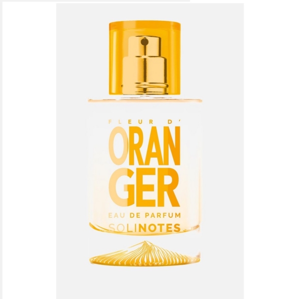 Un flacon en verre transparent de Solinotes Eau De Parfum Fleur D'oranger 50 ml pour Femme, avec un texte en gras orange et un bouchon vaporisateur orange assorti, se détache sur un fond blanc uni. Dakar