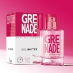 Un flacon rose de Solinotes Eau de Parfum Grenade 50 ml se trouve devant sa boîte assortie, tous deux affichant des lettres "GRENADE" en gras pour un look vibrant et élégant. Dakar