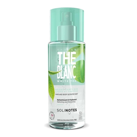 Un flacon pulvérisateur transparent de 250 ml de Solinotes Thé Blanc Brume parfumée pour Femme, avec des accents verts, des graphiques de feuilles, et des informations détaillées sur le produit sur l'étiquette. Dakar